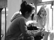 People using a mobile app together in a casual setting.