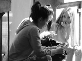 People using a mobile app together in a casual setting.