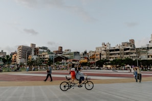 Wide shot of a vibrant community square within a new housing development