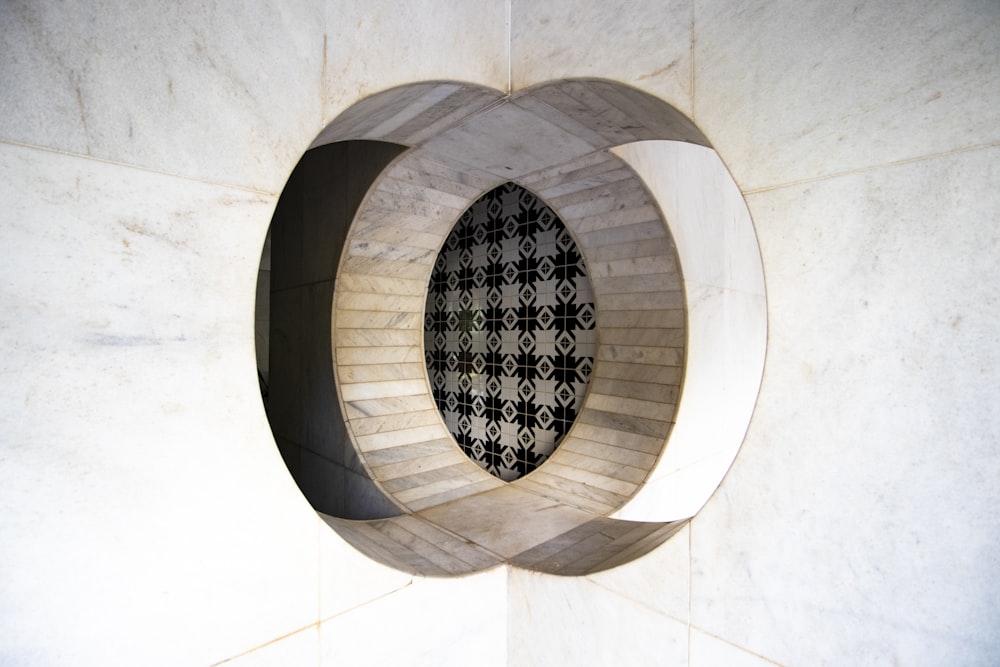 brown round concrete tunnel with black round hole