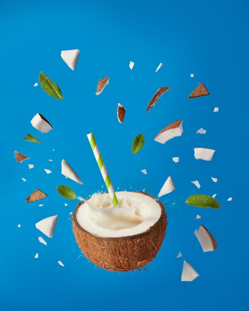 brown and white cake with white cream and green leaves on top