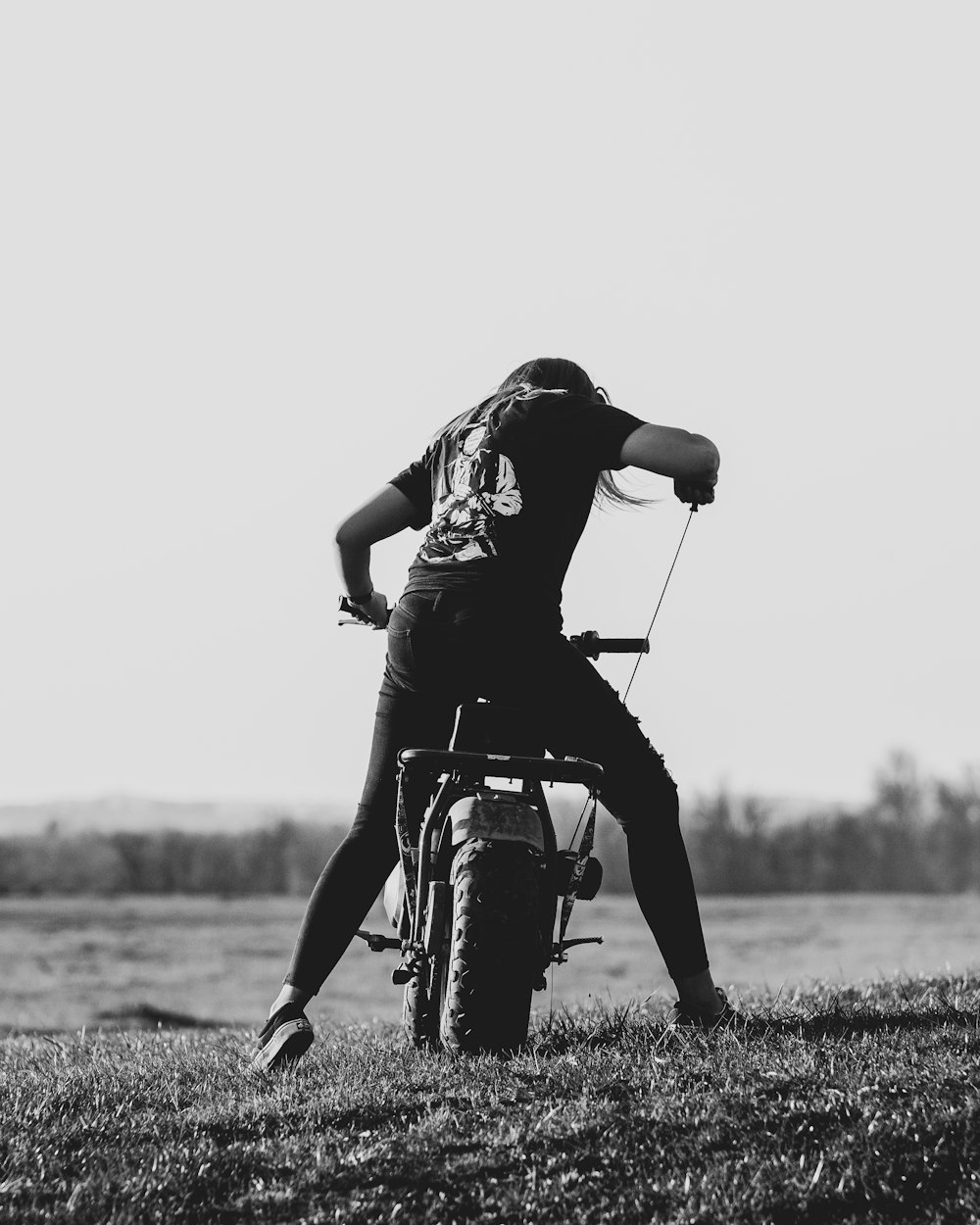 grayscale photo of man riding motorcycle