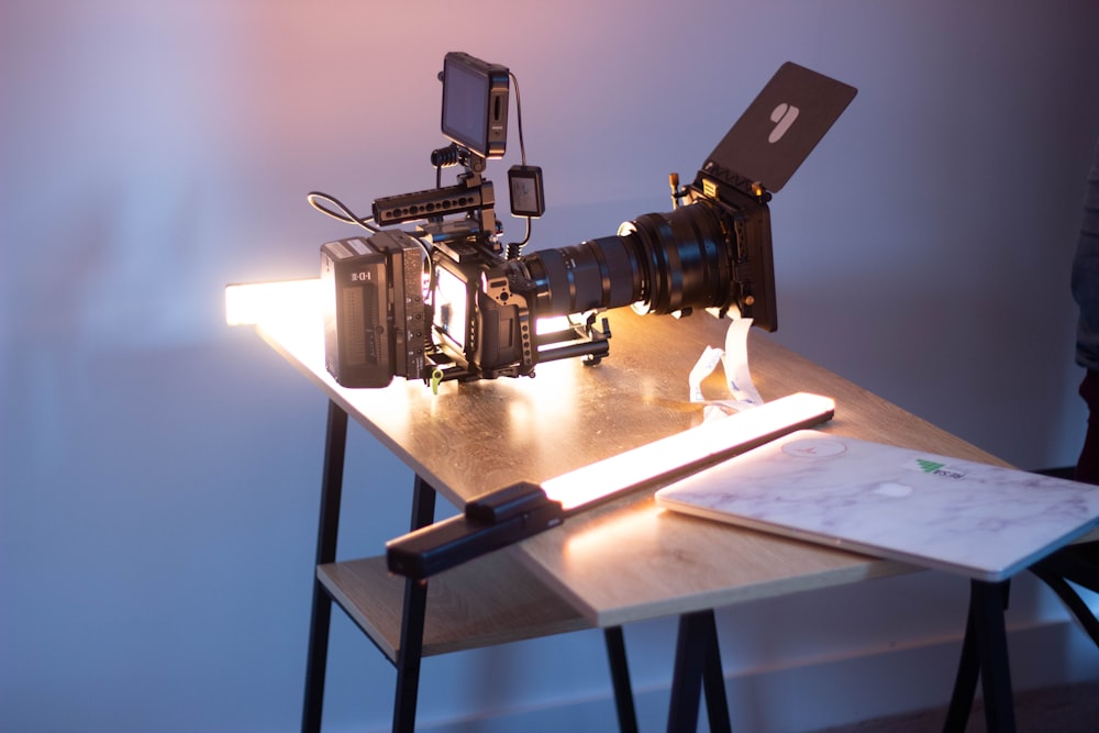 black and gray camera on white table