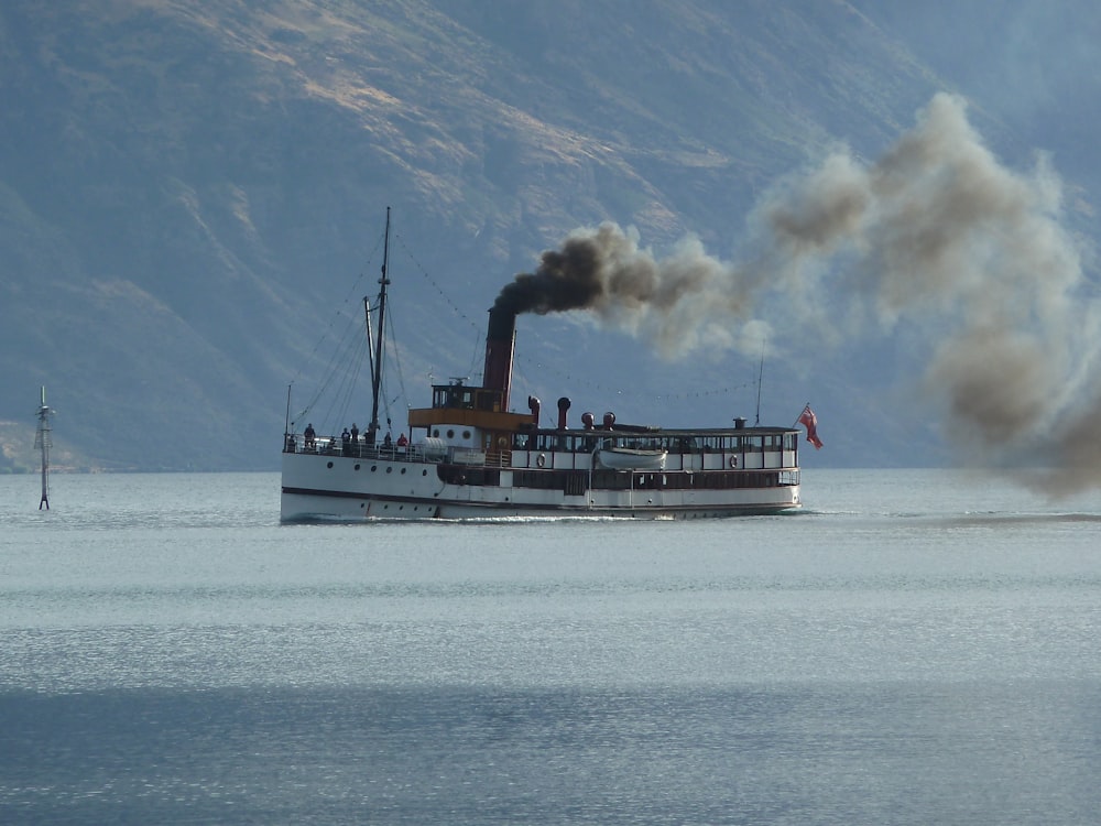 white ship on sea during daytime