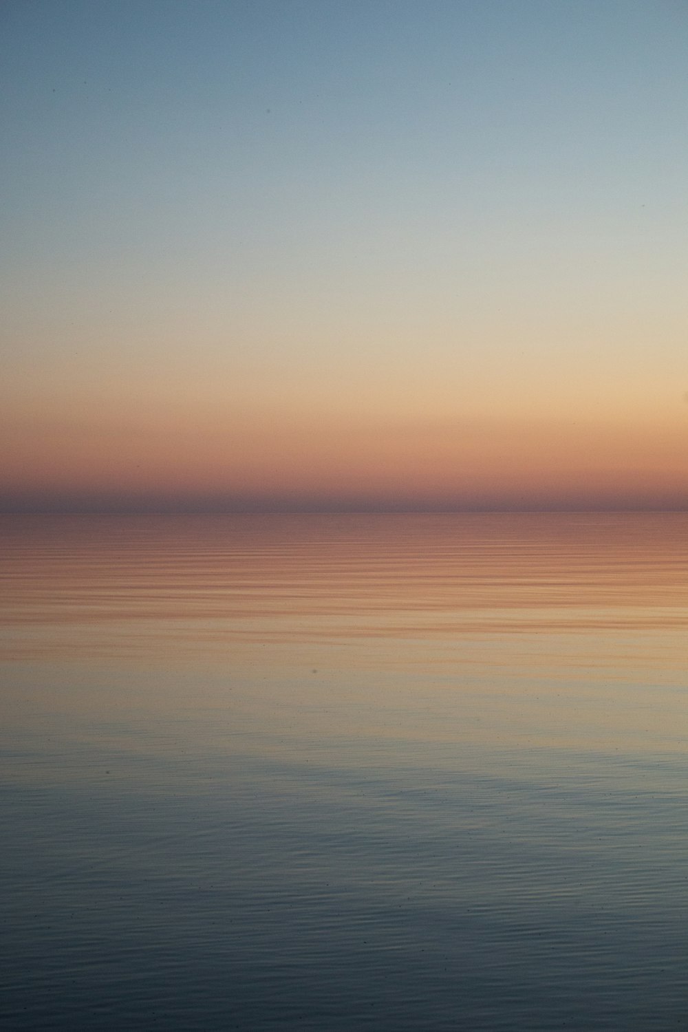 body of water during sunset