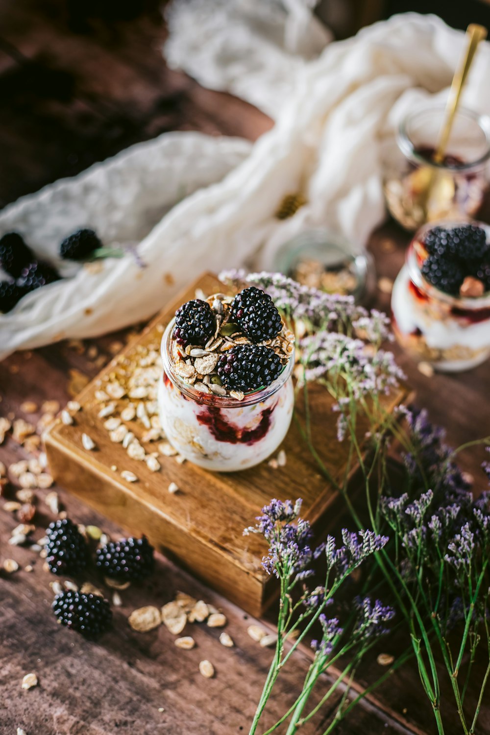 black berries on white ceramic bowl