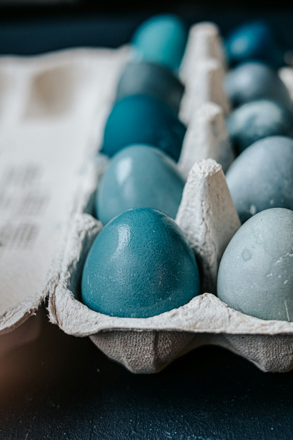 blue egg on brown paper bag