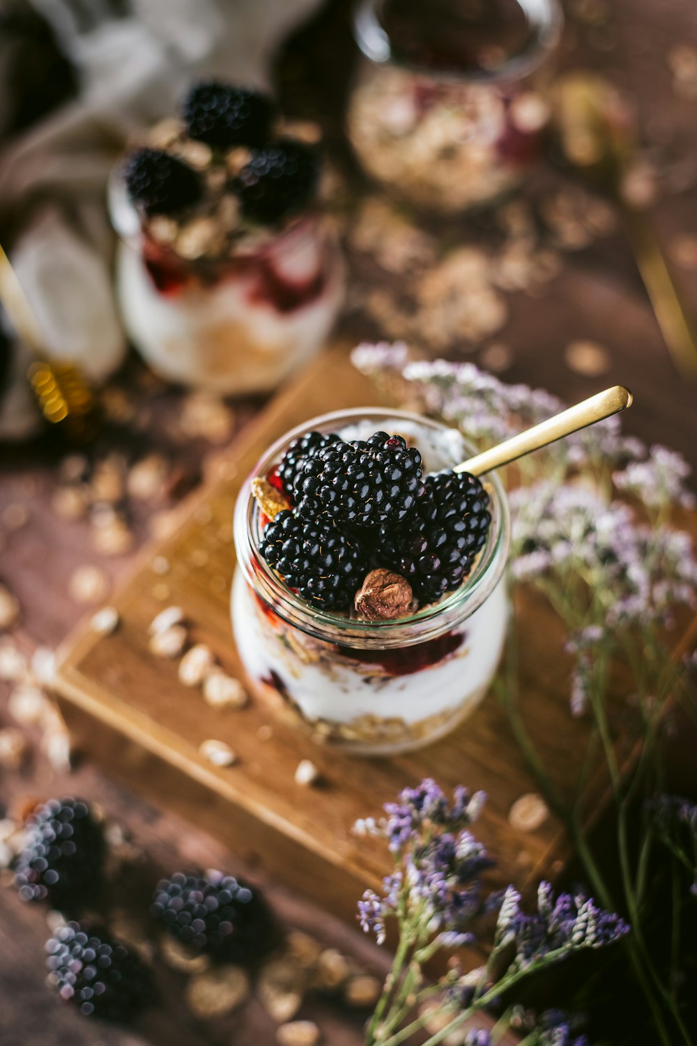 black berries in clear glass cup