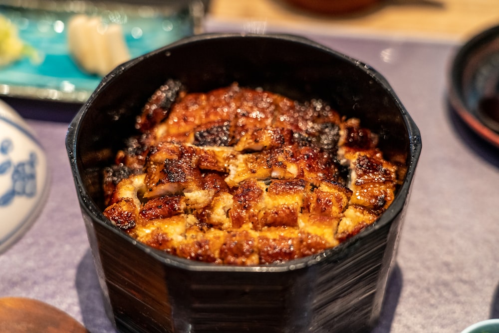 cooked food in black bowl