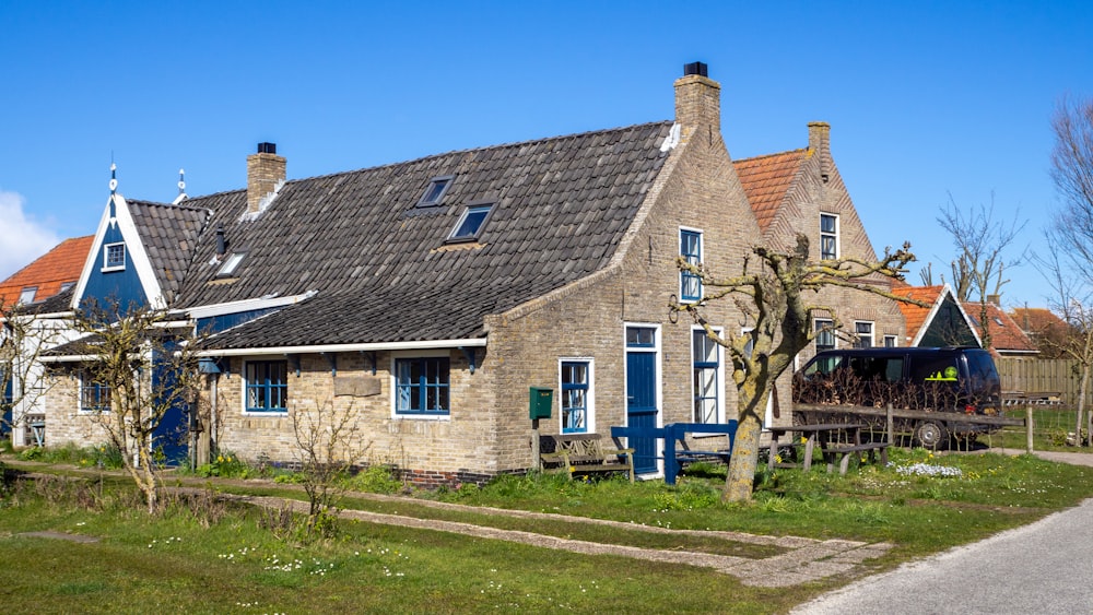 brown and white concrete house under blue sky during daytime