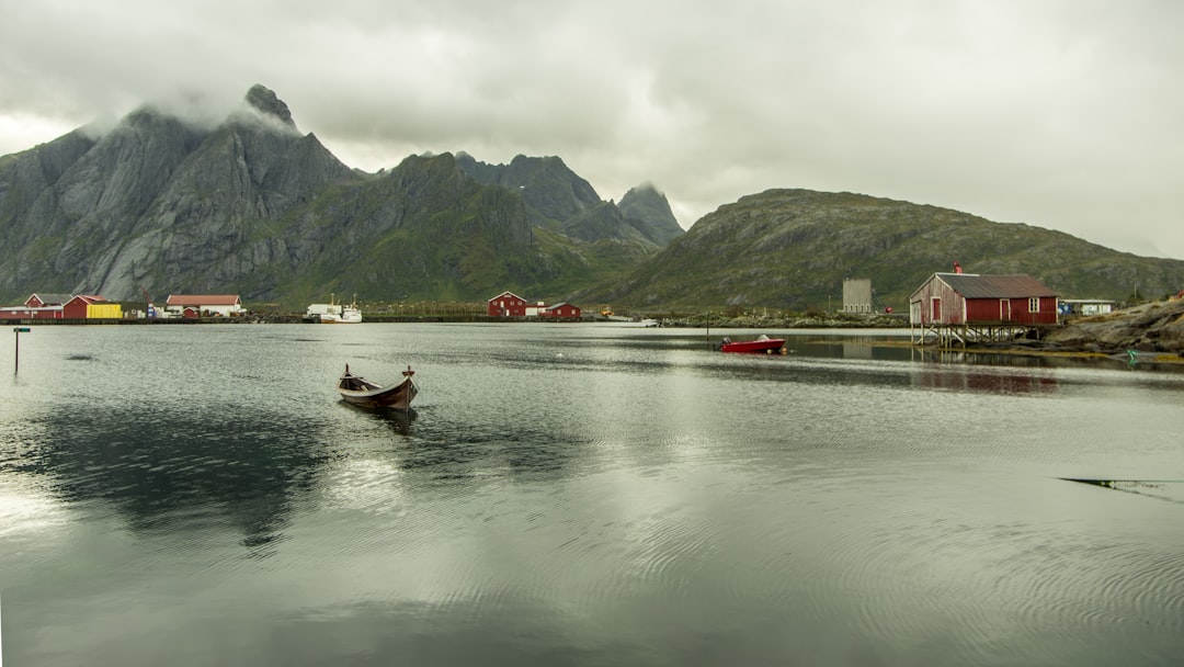 man riding on boat on river during daytime