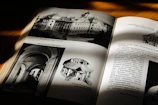 Open archaeology book showing excavation site photographs and maps.
