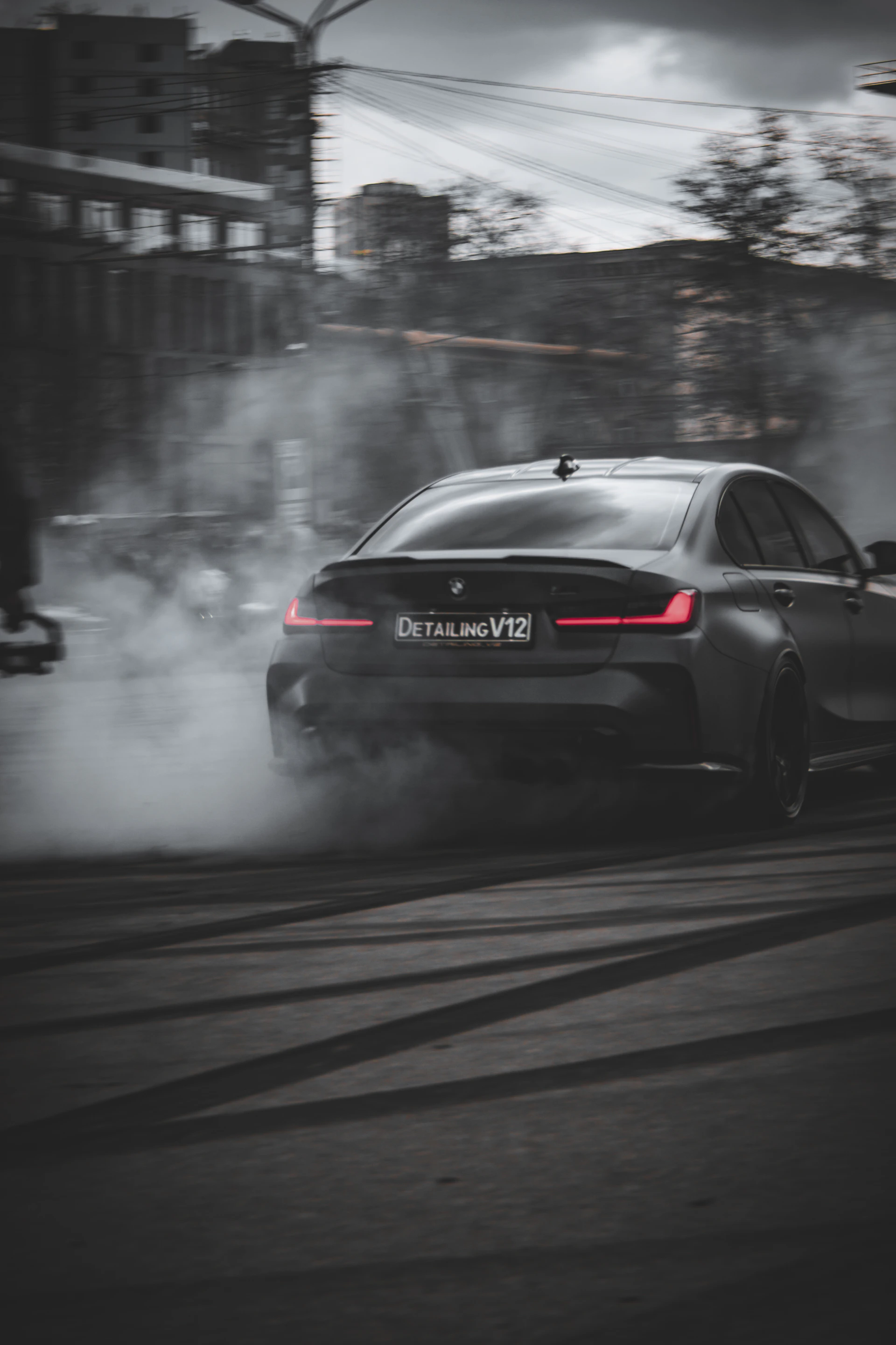 An intense action scene from the GTA 6 gameplay video featuring a high-speed car chase through winding urban roads.