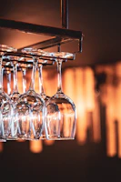 Artistic shot of a set of elegant glassware arranged on a marble countertop.