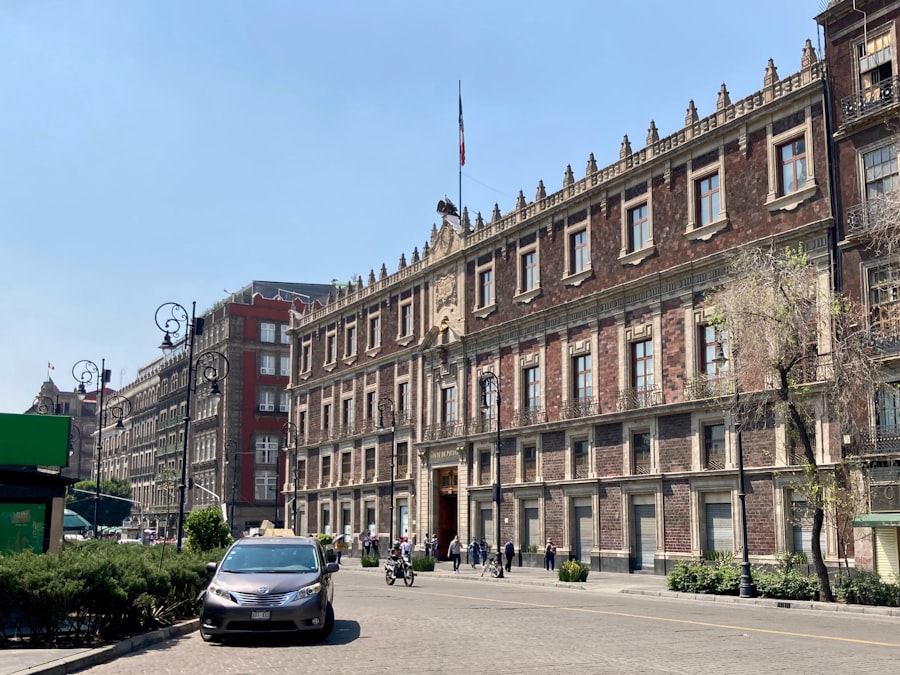 Colonial-era buildings lining a wide street in Mexico City's historic centre