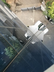 Outdoor view of Pension Elisa building with parking area.