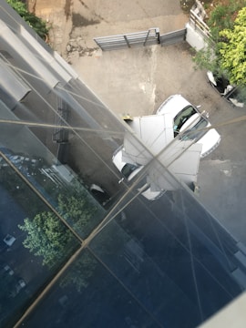 Outdoor view of Pension Elisa building with parking area.