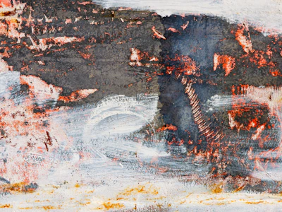 Close-up of a textured abstract painting with soft, earthy tones and subtle brushstrokes.
