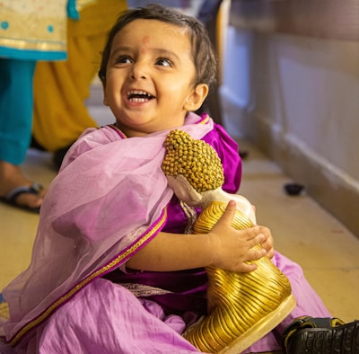 Children joyfully participating in a cultural event organized by the sangha.