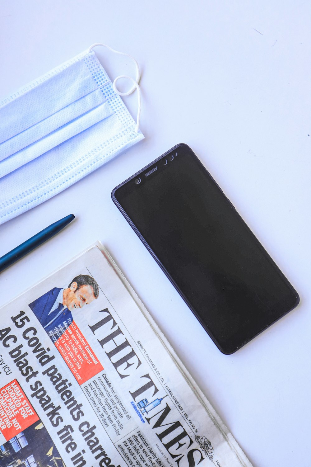 a cell phone and a face mask on a table