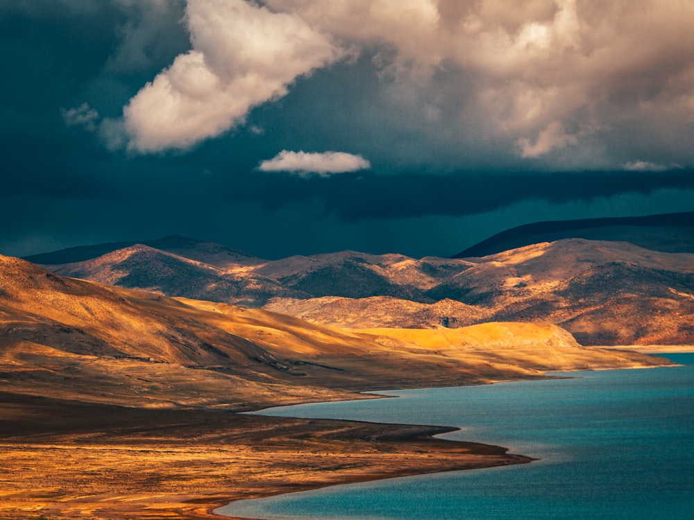 blue sea under blue sky and white clouds during daytime