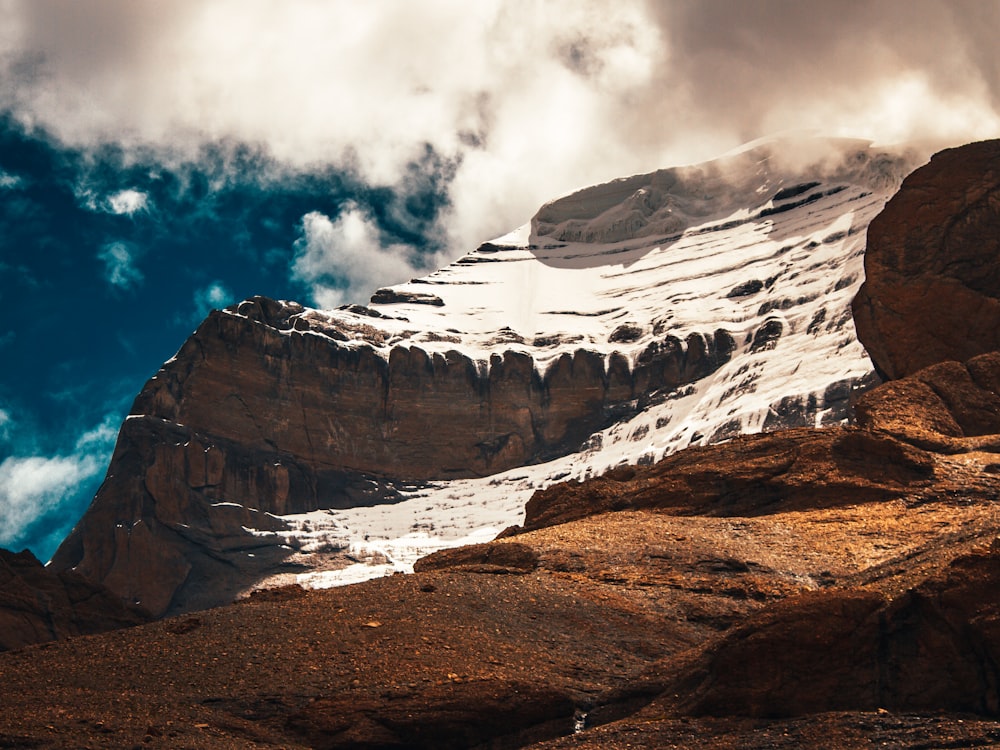 rocky mountain under cloudy sky during daytime