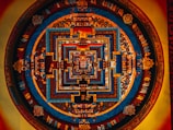 A close-up of intricate mandala patterns on a vibrant tapestry.