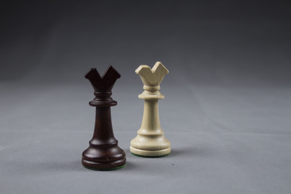 brown wooden chess piece on white table