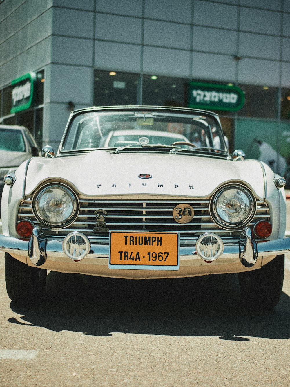 white classic car on road during daytime