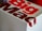 A close-up of a Big Mac packaging box with bold red and white lettering, showcasing part of the logo and design.