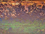 Close-up of a heavily rusted metal surface before laser cleaning.