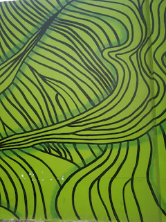 A modern mural blending organic shapes with luxurious green garden elements.