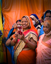 Illustration of diverse Indian laborers—construction, farm, and factory workers—smiling and using a smartphone together.