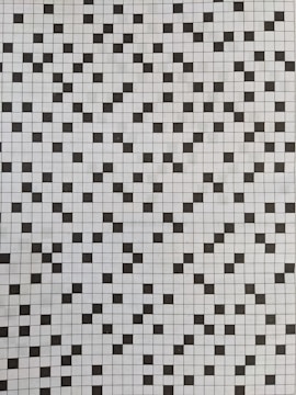 A grid of black and white squares creates a checkerboard pattern. The squares are arranged in a random order, interspersing black squares with white ones across the grid, creating a visually dynamic and recurring pattern.