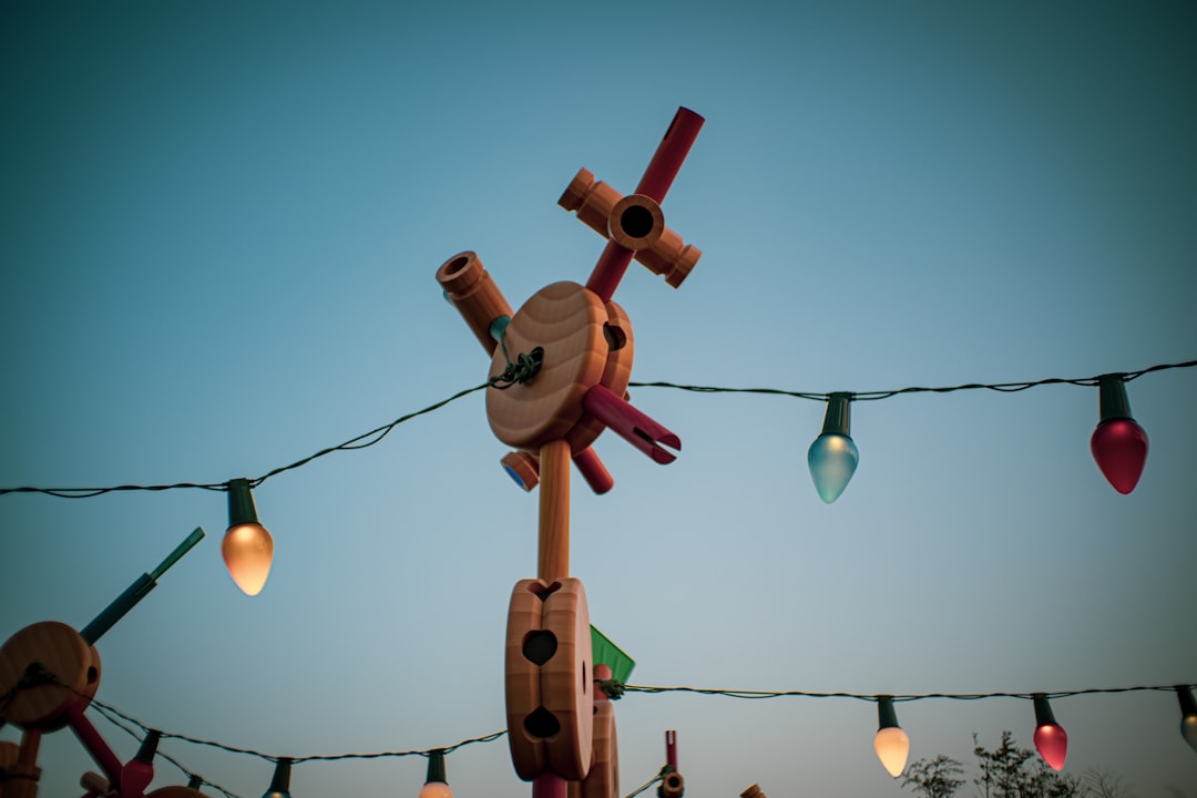 brown wooden cross with light bulb