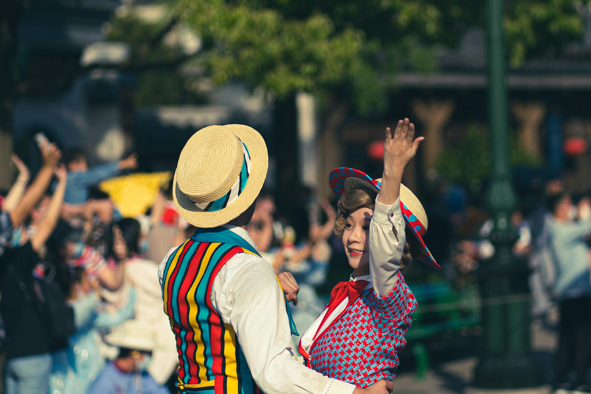 A joyful audience dancing in vintage attire, capturing the timeless spirit of swing music at a Swing Legends event.