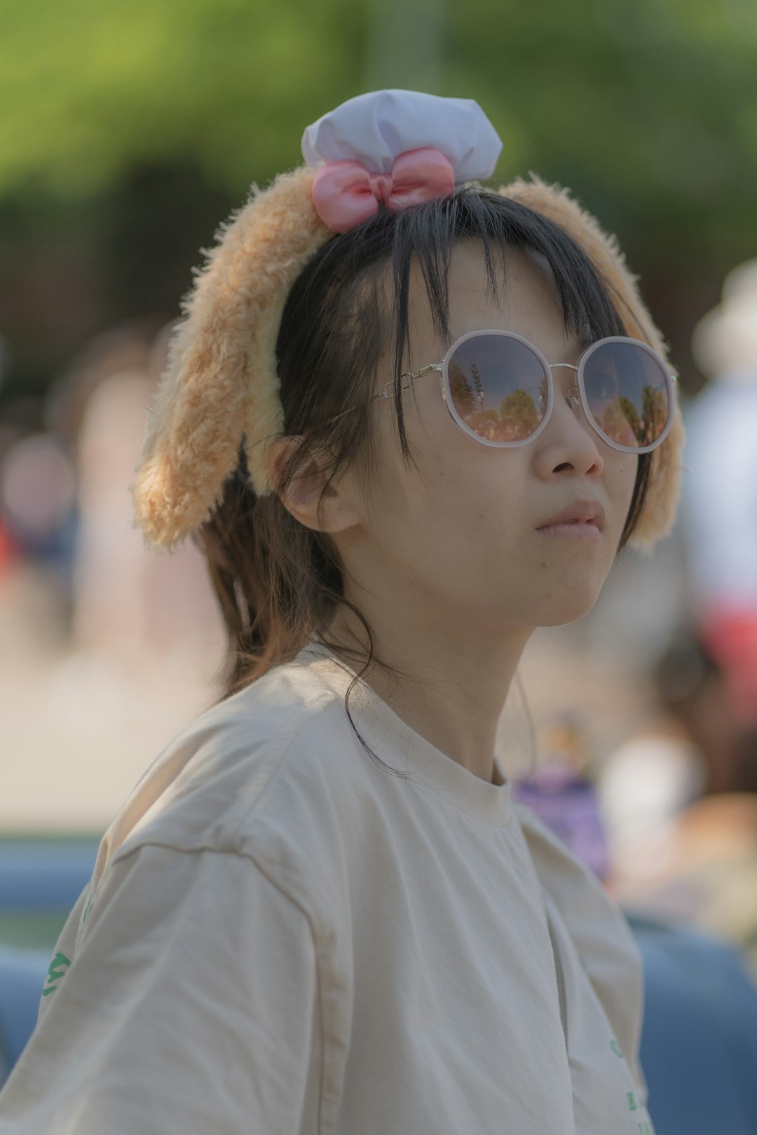 woman in white crew neck shirt wearing aviator sunglasses