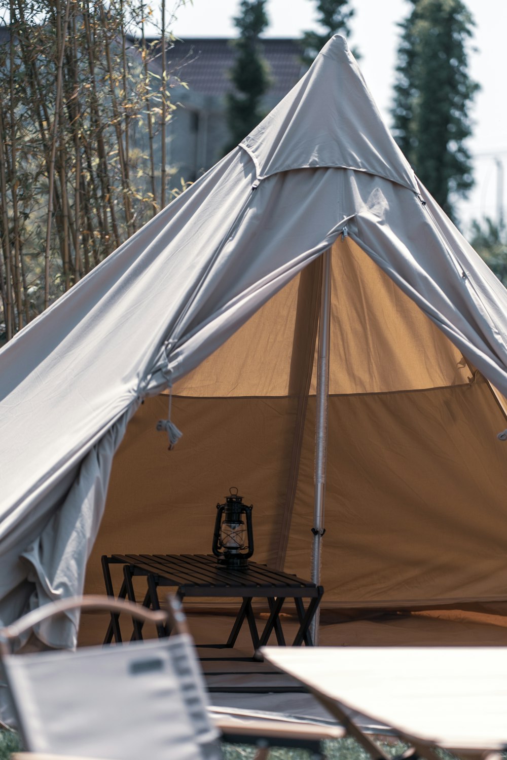 white tent with light turned on during daytime