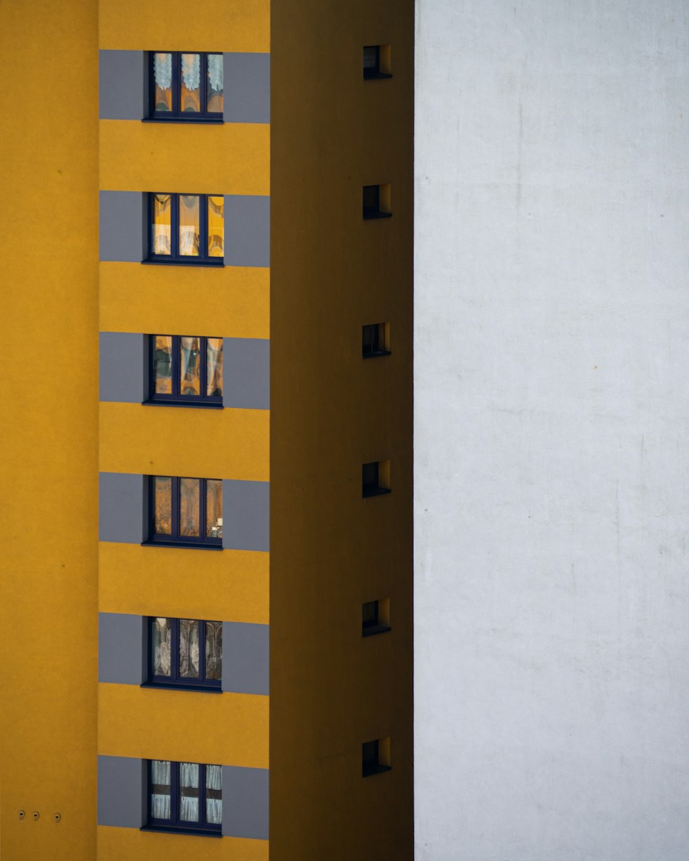 yellow and white concrete building