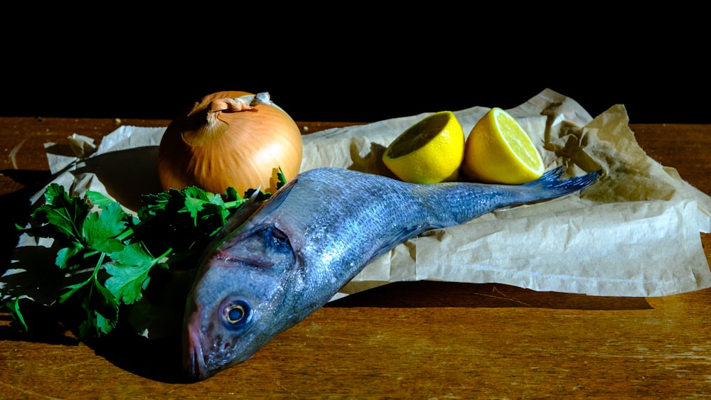 blue and yellow fish on brown wooden table