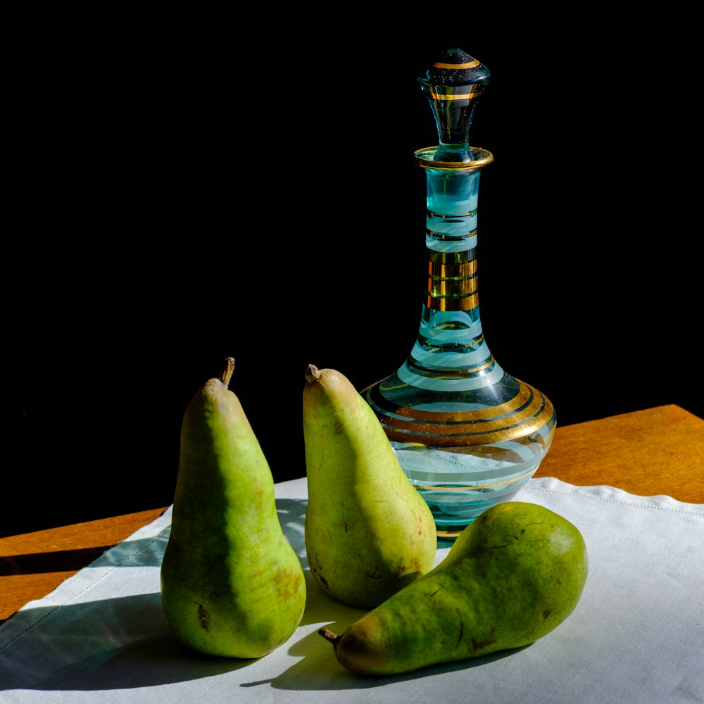 sliced green fruit on clear glass footed bowl