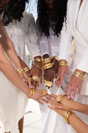 Client photo - Vesta stacked with hammered gold bangles