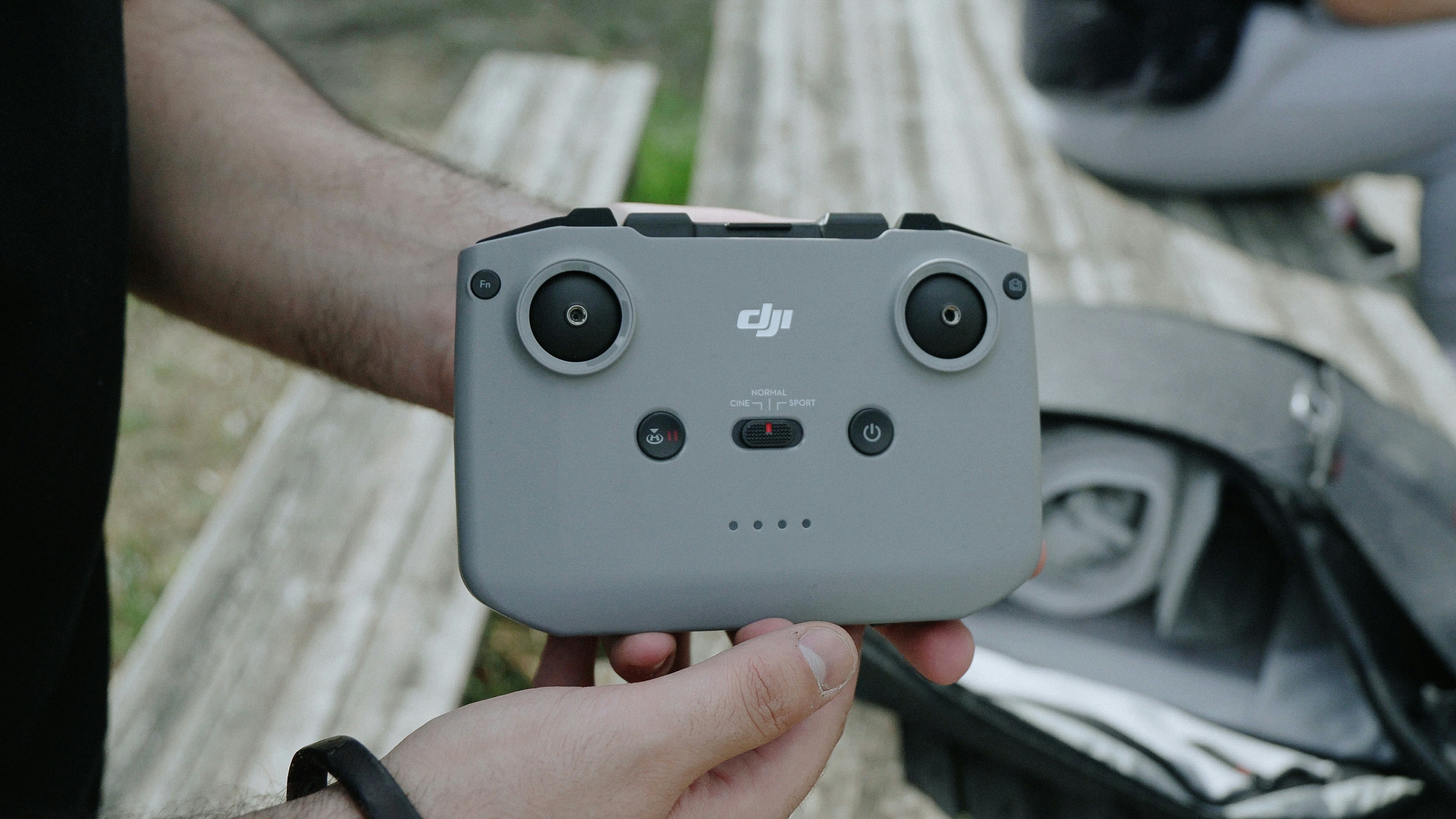 person holding gray nintendo game controller