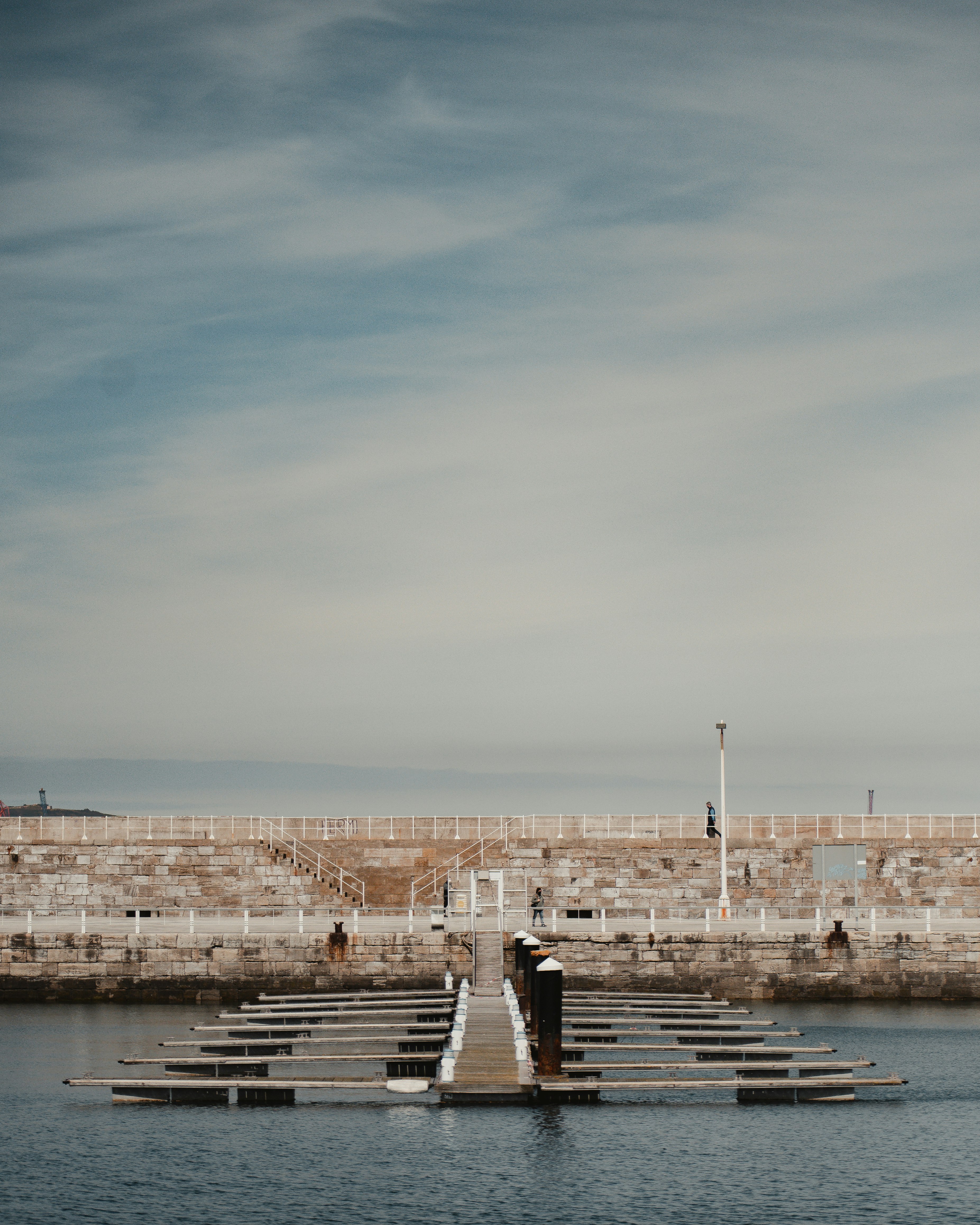 people walking on dock during daytime