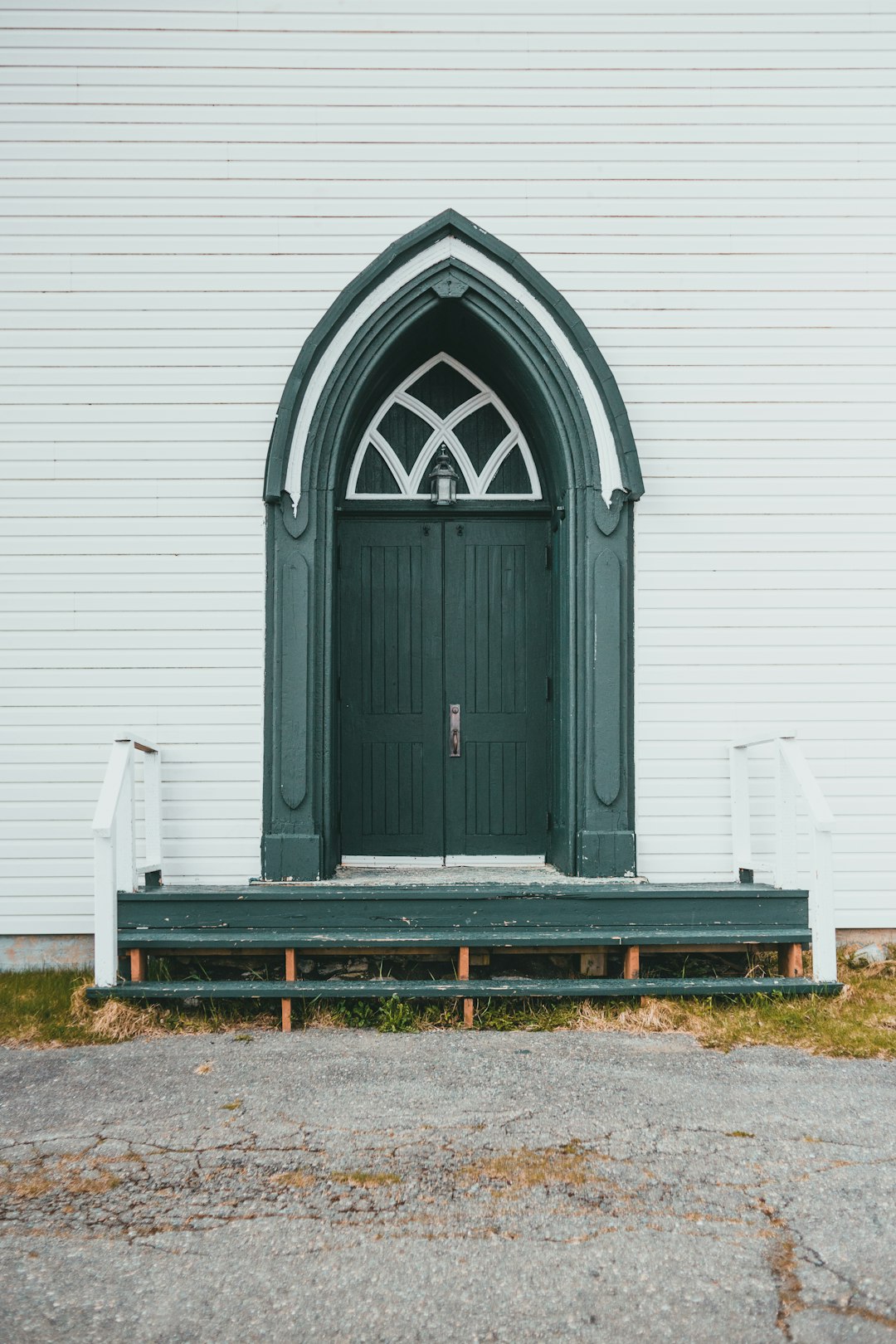 gray wooden door on white wall