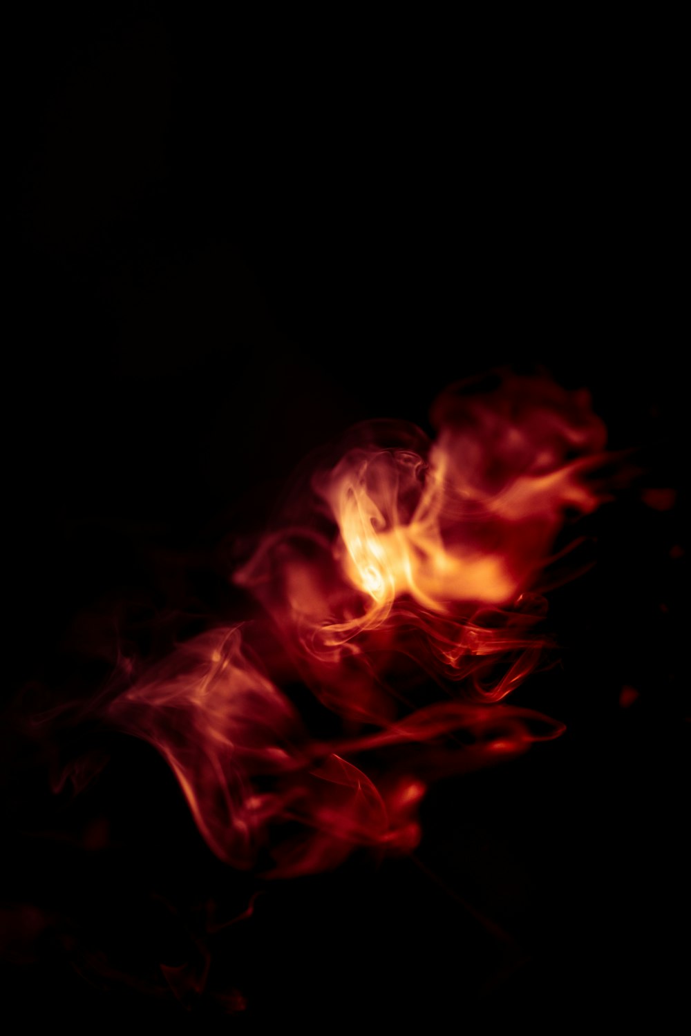 red and yellow fire in dark room
