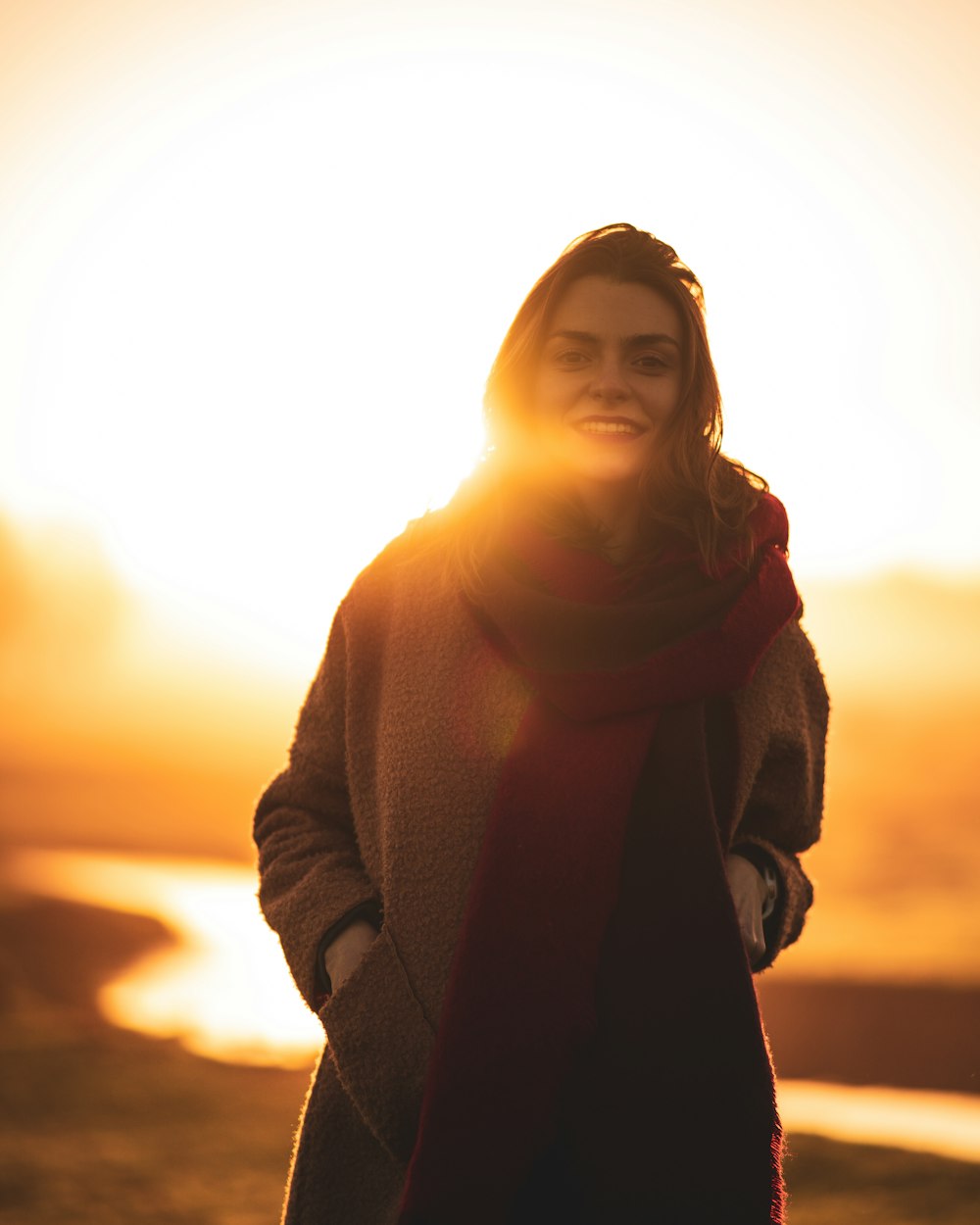 woman in brown scarf and black coat