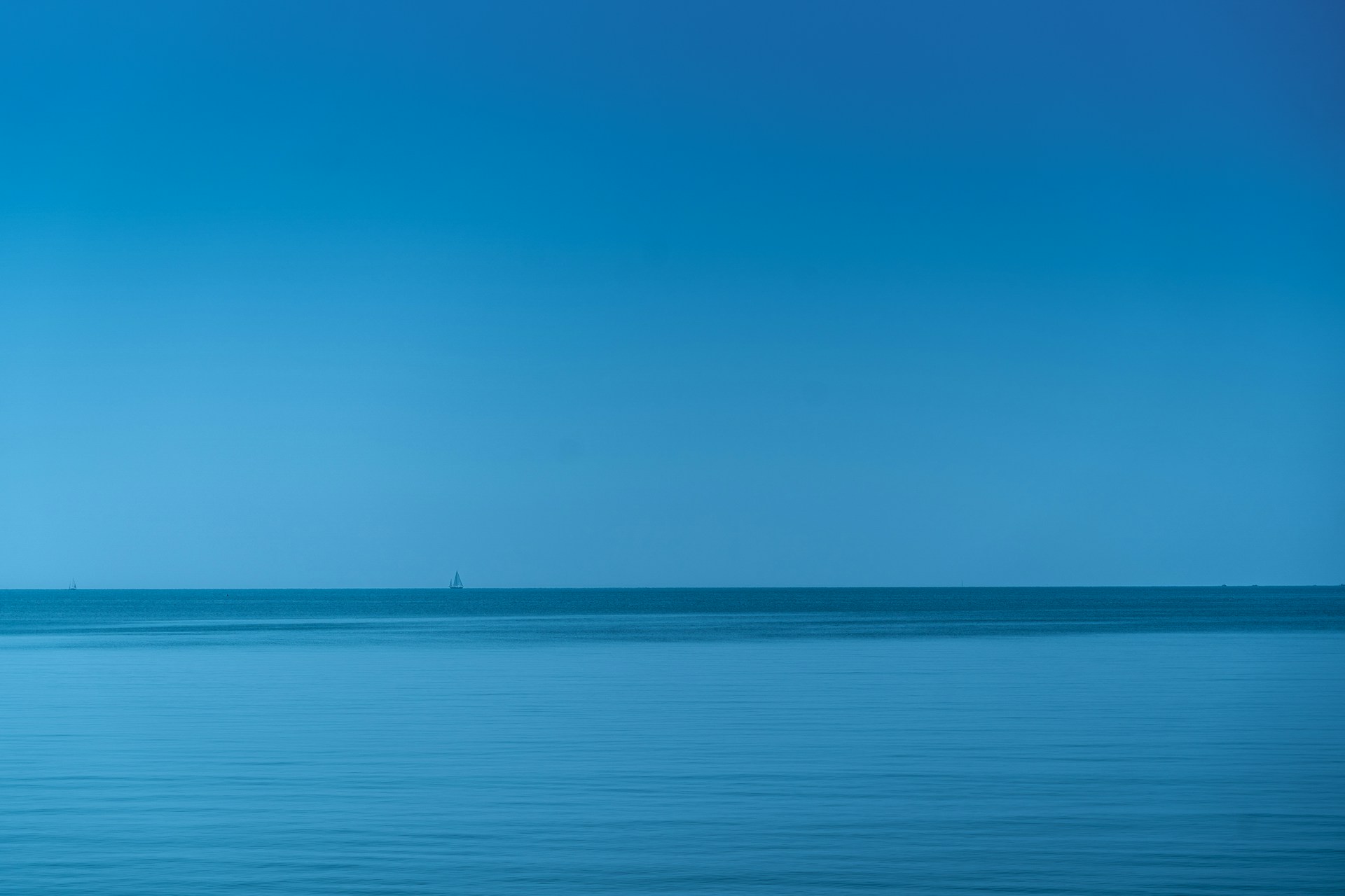 body of water under blue sky during daytime