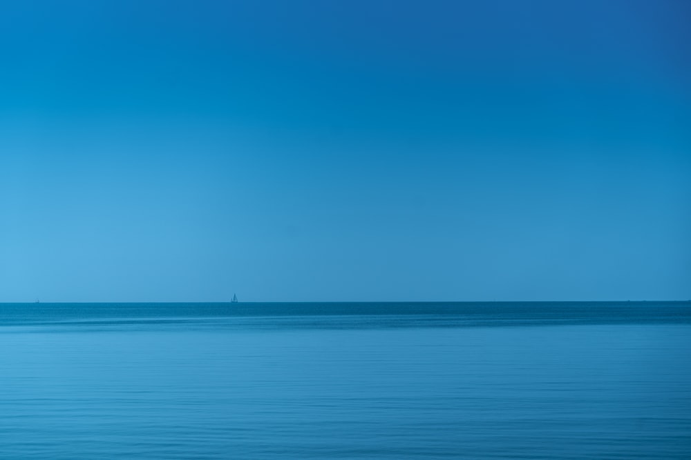 body of water under blue sky during daytime