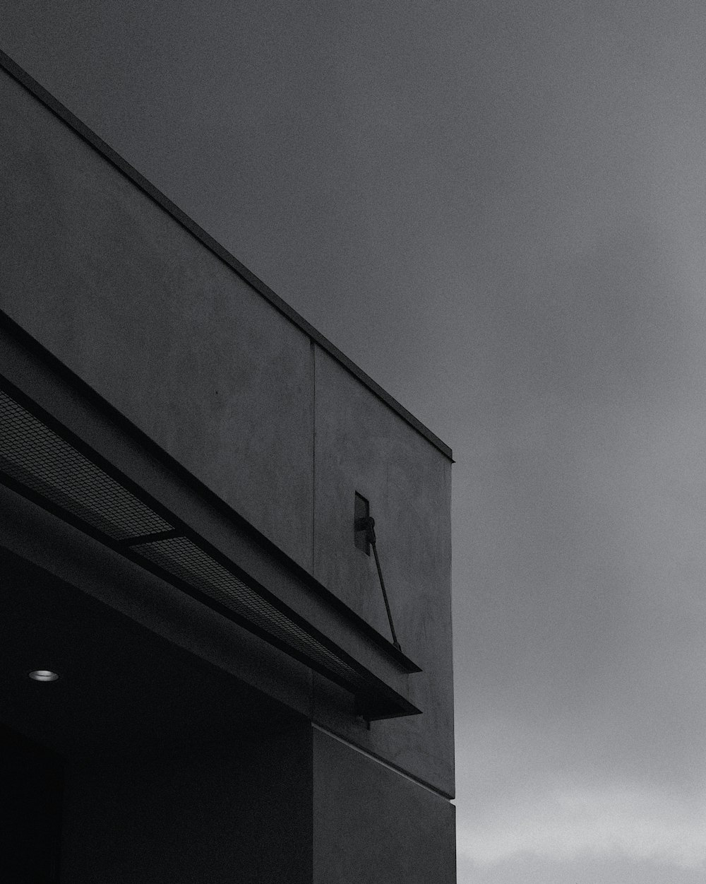 black concrete building under gray sky